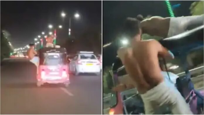 Noida Expressway पर पागलपन! चलती ऑटो पर स्टंट करने वाले लड़कों का वीडियो वायरल, पुलिस ने दबोचा Noida Expressway पर पागलपन! चलती ऑटो पर स्टंट करने वाले लड़कों का वीडियो वायरल, पुलिस ने दबोचा